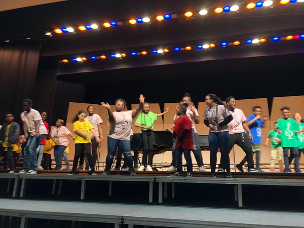 Students of the NAHS Choir celebrate a fun-filled day of singing and learning with the elementary and middle school students. 