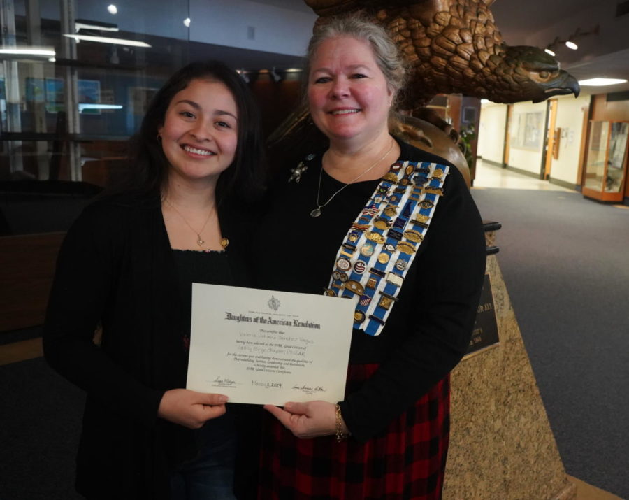 Valeria Sanchez (left) accepts the Daughters of the American Revolution Good Citizen Award. 