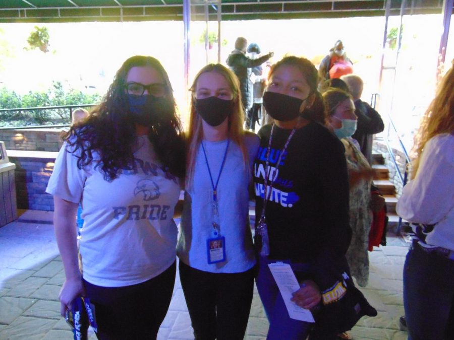 Juniors Layla Chaaraoui (left) and Ashley Carmona (right) meet Marissa Dell (center), a Norristown graduate running for NASD school board.  