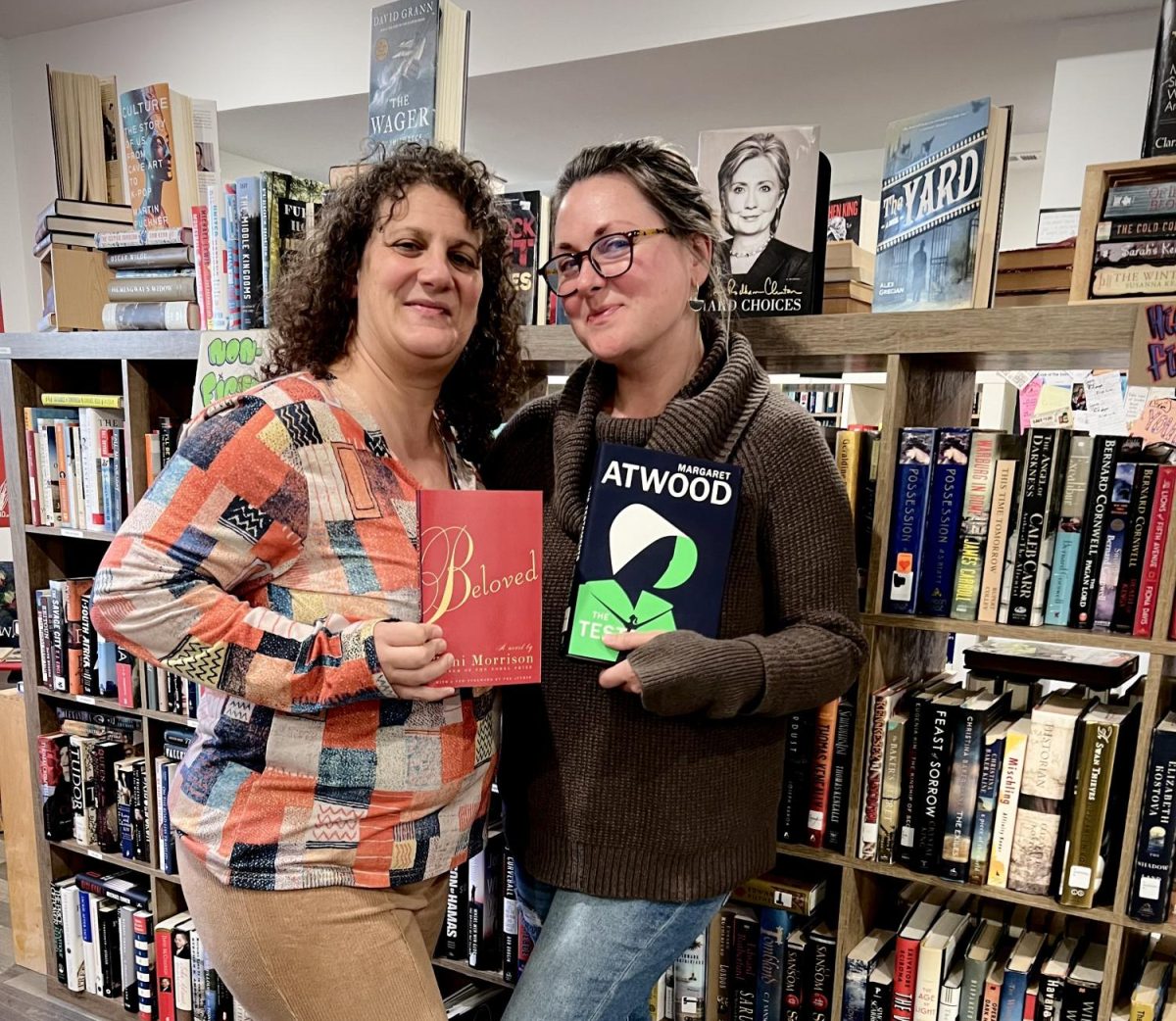 Angela Smith (left) and Kate Jaworski stand in front of a diverse selection of books at Recycle Read Repeat at 208 Cherry Street in Norristown. 